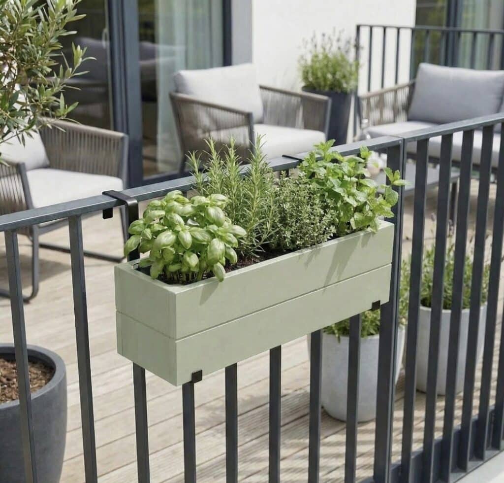 Balcony railing planter with herbs to add lush greenery for small balcony ideas without using floor space