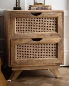Rattan bedside table in the black and beige bedroom design