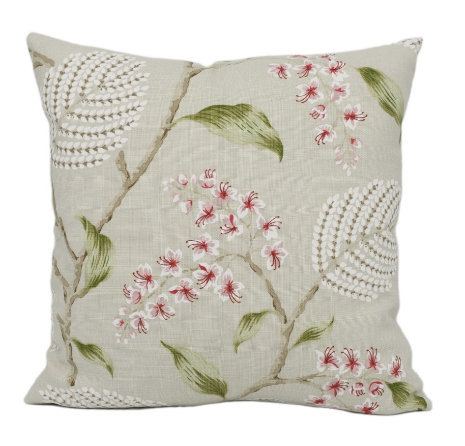 Pink and green cushions with trailing floral print by Colefax and Fowler