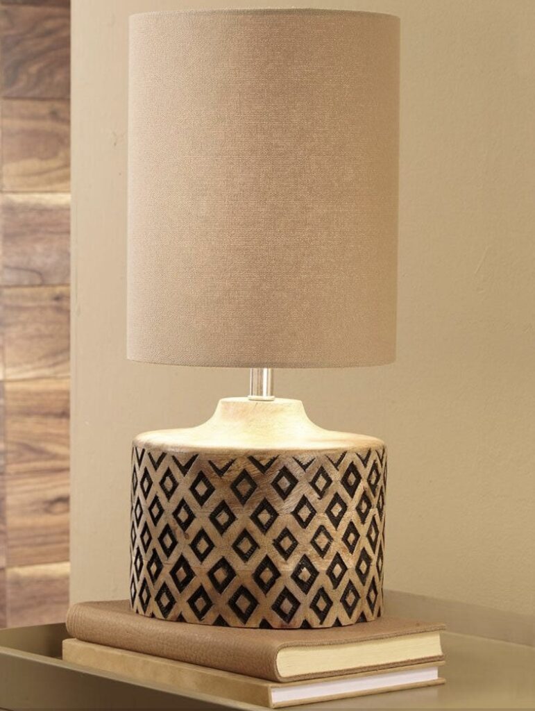 Beige and black carved table lamp for black and beige bedroom styling