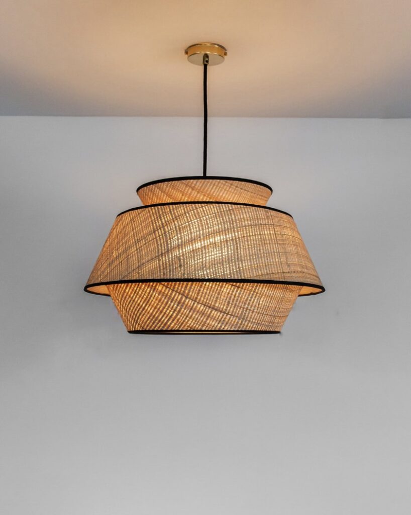 Natural raffia pendant light for a black and beige bedroom