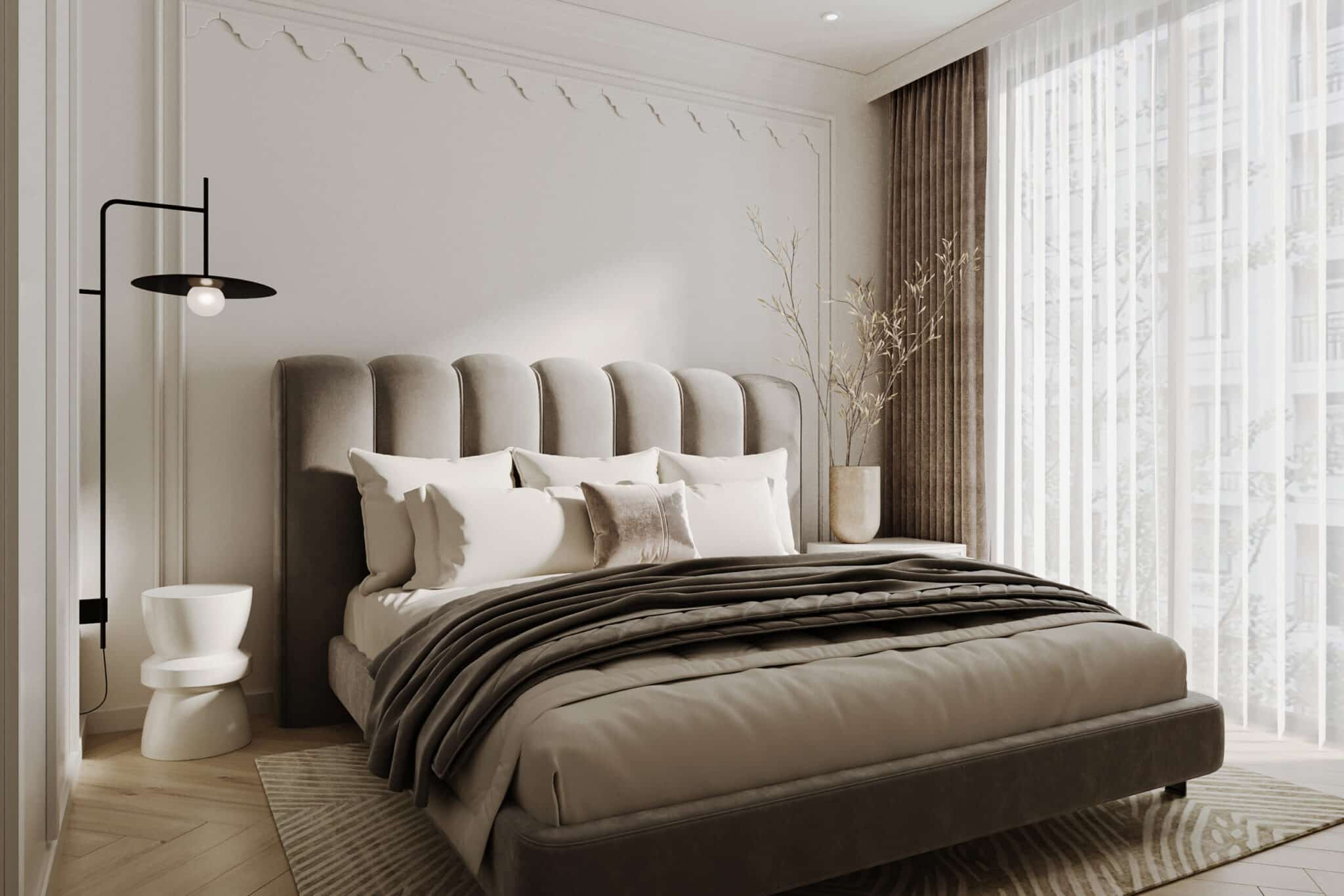 Beige and black bedroom with layered bedding and black accents