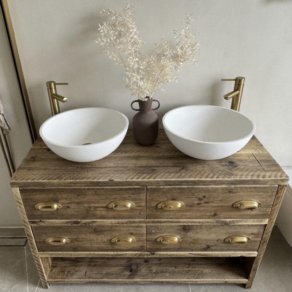 Reclaimed wood double bathroom vanity unit with brass cup handles and white oval vessel basins