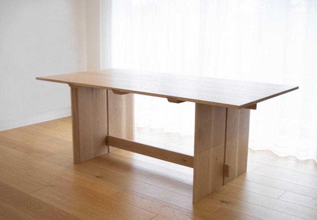 Japandi solid oak six seater dining table with slab legs handmade by WestgarthWoodworks in Chepstow Wales