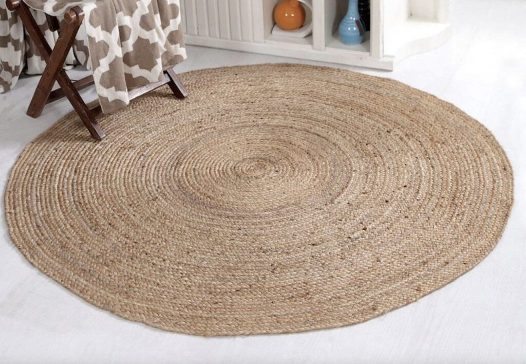 Natural jute round rug for layering – perfect in cottage bedroom ideas.