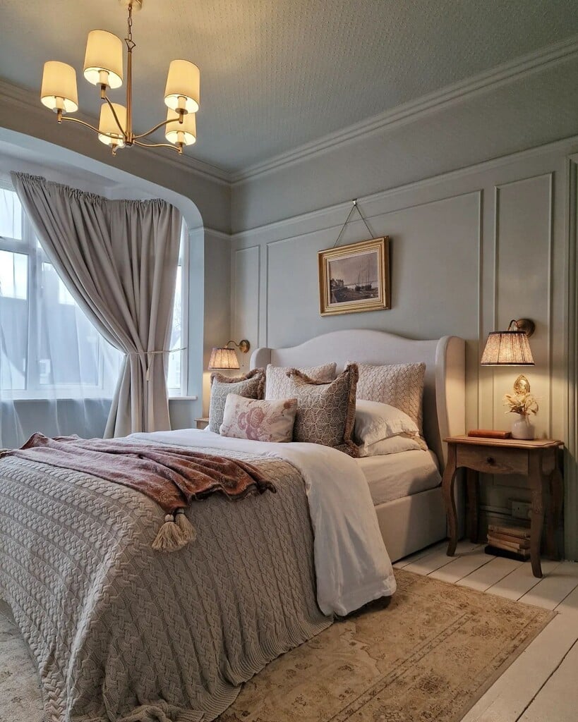 Blue and grey bedroom with Farrow & Ball Light Blue panelling and warm cable-knit throw