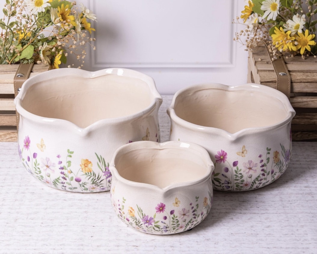 Scalloped floral bathroom plant pot on a ledge fir a budget bathroom