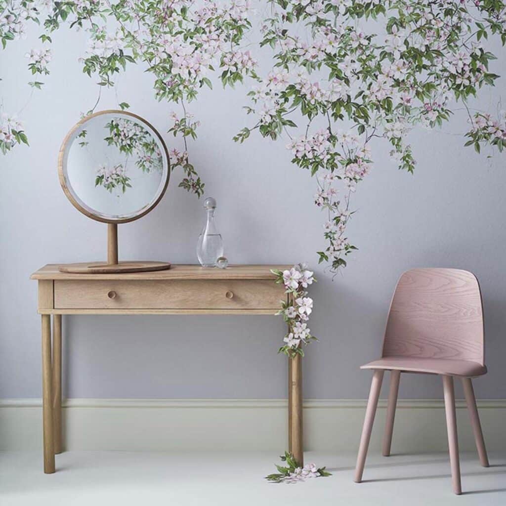 Blue clematis hanging floral wallpaper mural behind dressing table