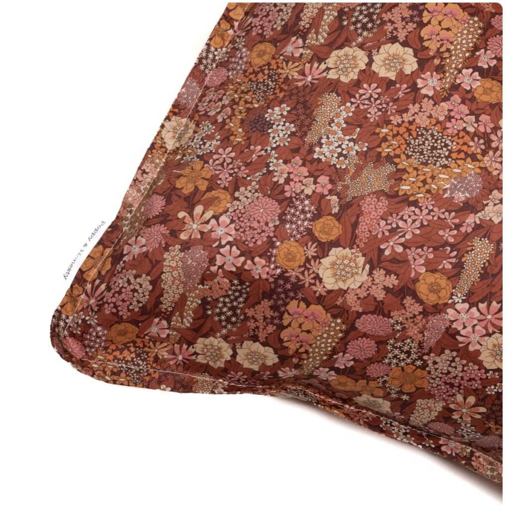 Vintage-style Liberty print pillowcase in Ciara Metallic – rich florals that enhance the warmth of a burnt orange bedroom with timeless burnt orange accessories flair.