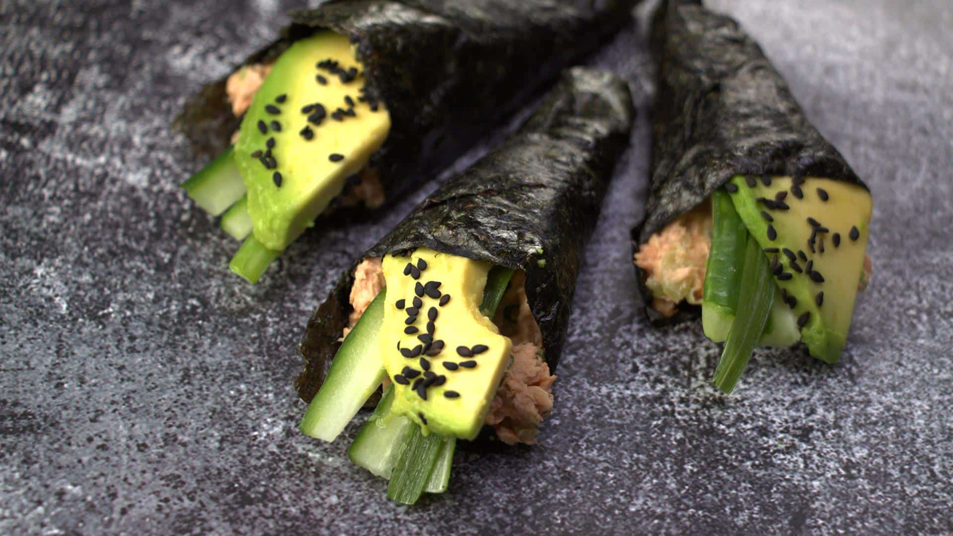 Easy fiery canned tuna sushi roll on a wooden board