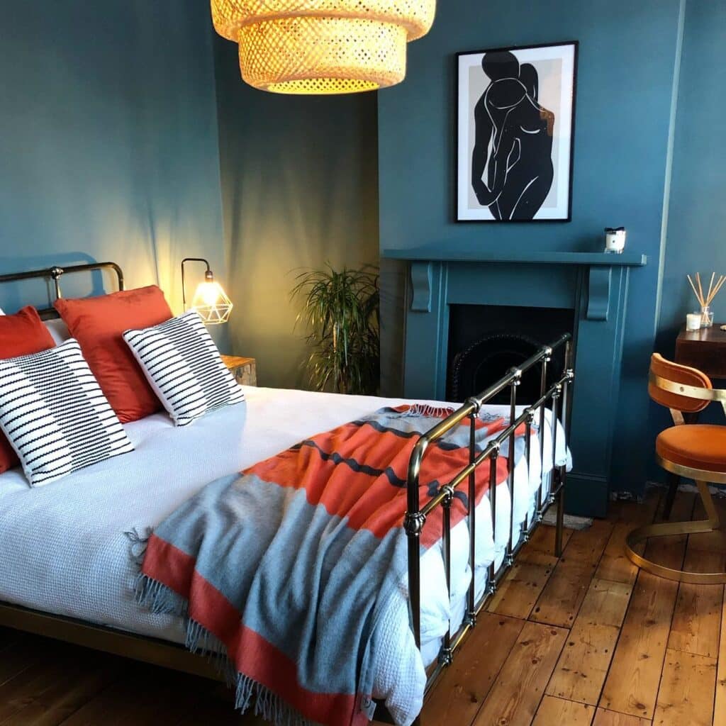 Budget bedroom ideas: colour drenching in Inchyra Blue with iron bed, terracotta bedding and rattan pendant light @hammerithomely / Farrow & Ball Inchyra Blue