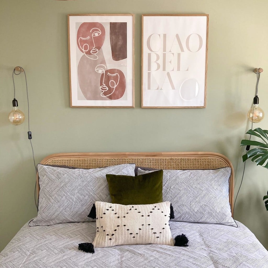 Budget bedroom ideas: bare Edison cable lights as bedside sconces with rattan headboard and gallery wall @madeupstyle