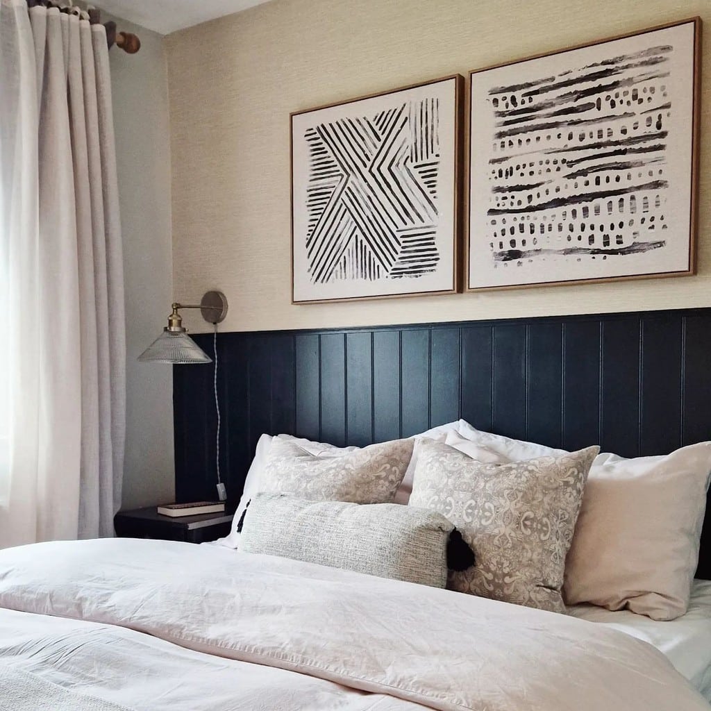 Budget bedroom ideas: tongue-and-groove headboard panel in Farrow & Ball Railings with abstract bedroom wall art diptych @richesinteriors