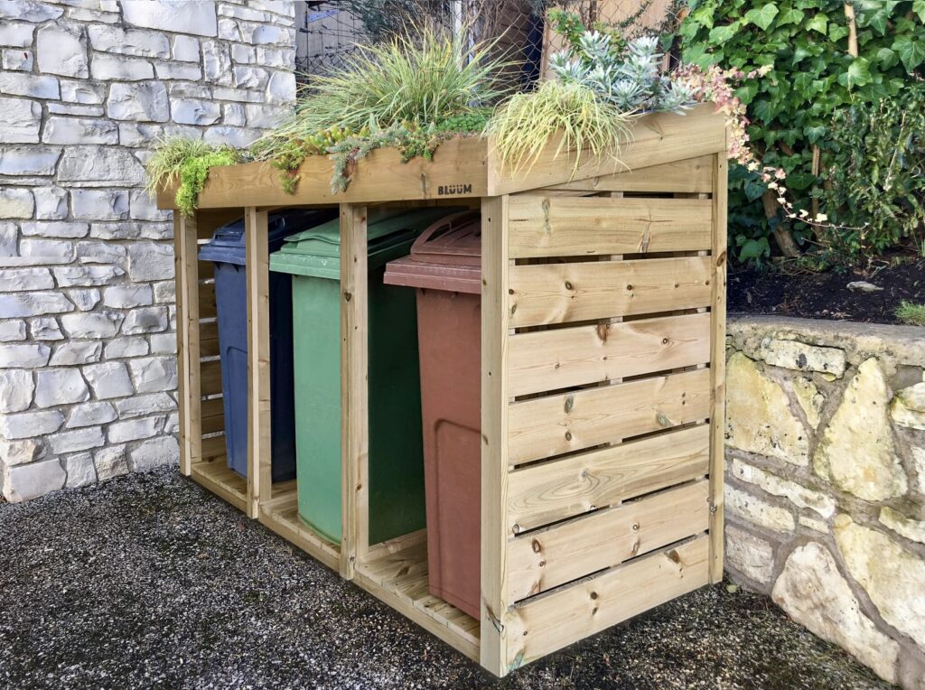 Triple wooden wheelie bin storage with green roof planter – ideal for stylish wheelie bin storage ideas