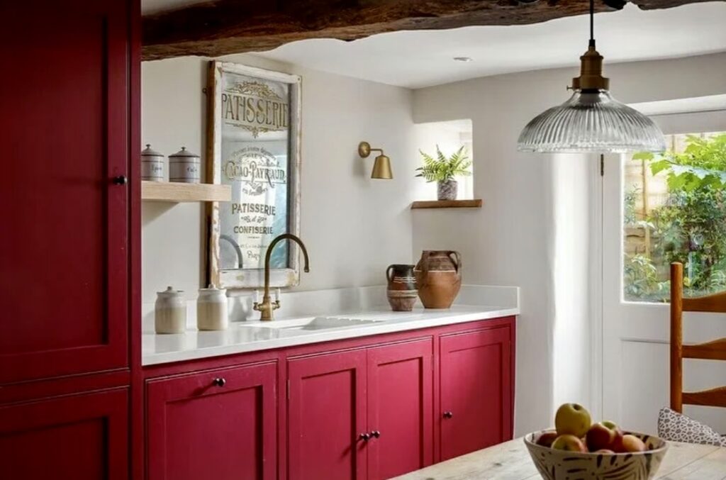 Small kitchen ideas with Farrow & Ball Radicchio red cabinets and rustic French-inspired styling