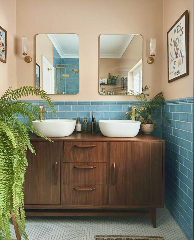Mid-century style pink bathroom with blush bathroom paint and blue tiles