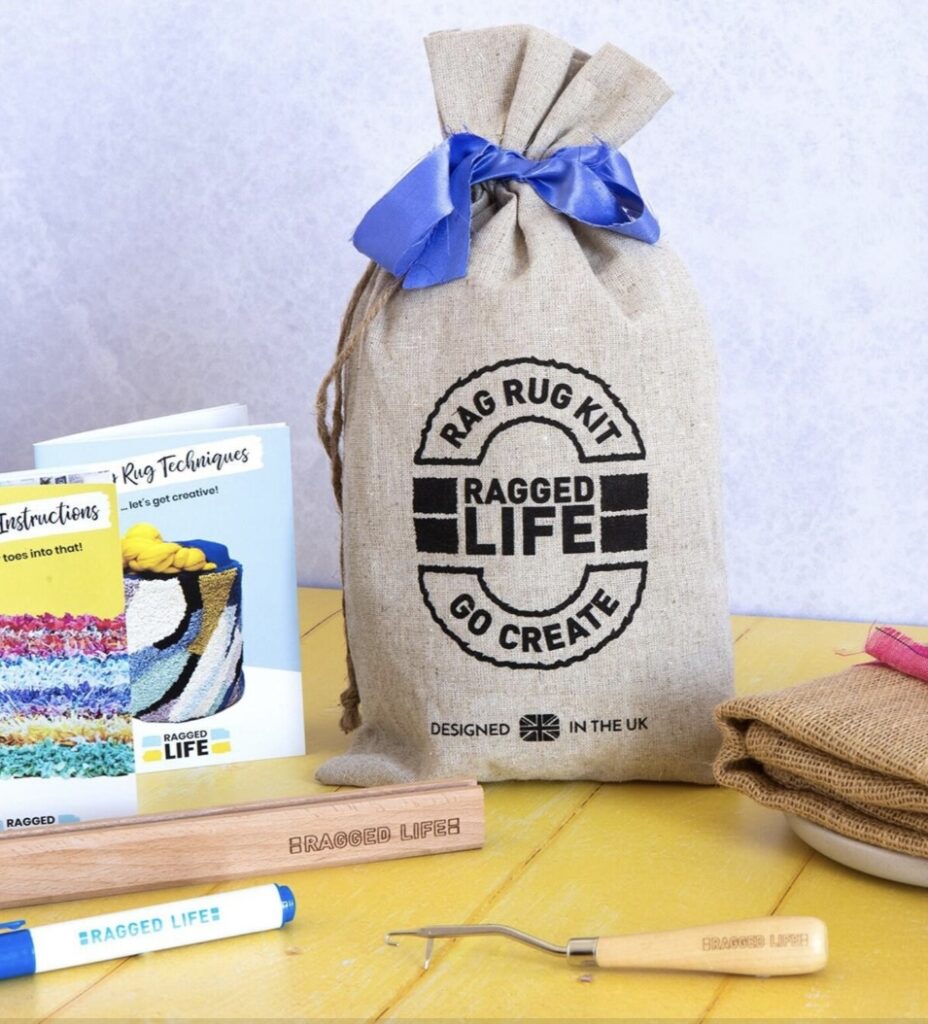 Rag rug kit by Ragged Life with latch hook, hessian, tools and instruction booklet, designed in the UK for upcycled craft projects.