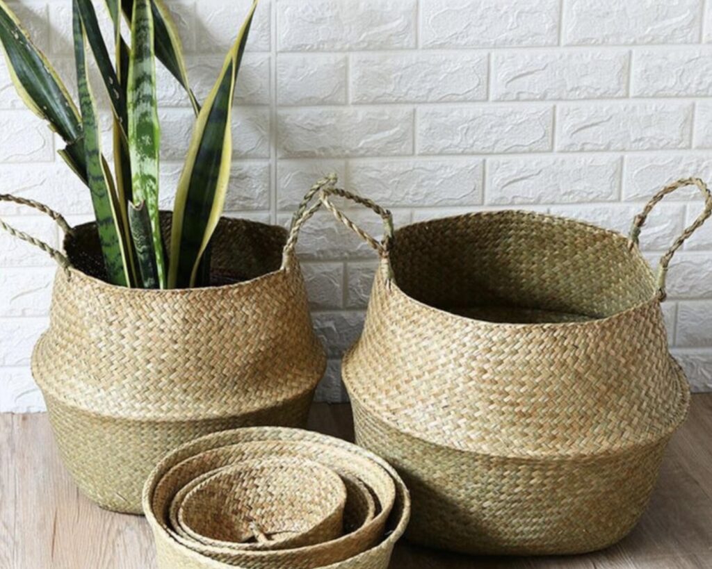 Woven seagrass baskets used for soft storage in a coastal interior design scheme with natural textures