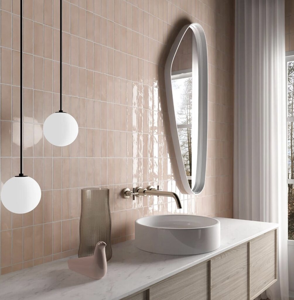 Modern pink bathroom with glossy pink bathroom tiles and pendant lights
