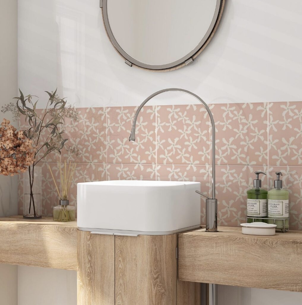Rustic vanity with white basin and jasmine-pattern pink bathroom tiles in a modern pink bathroom