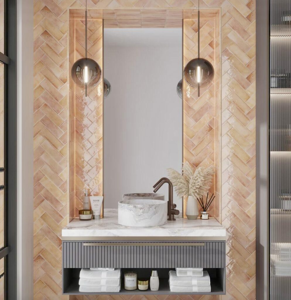 Contemporary pink bathroom with herringbone pink bathroom tiles and grey vanity