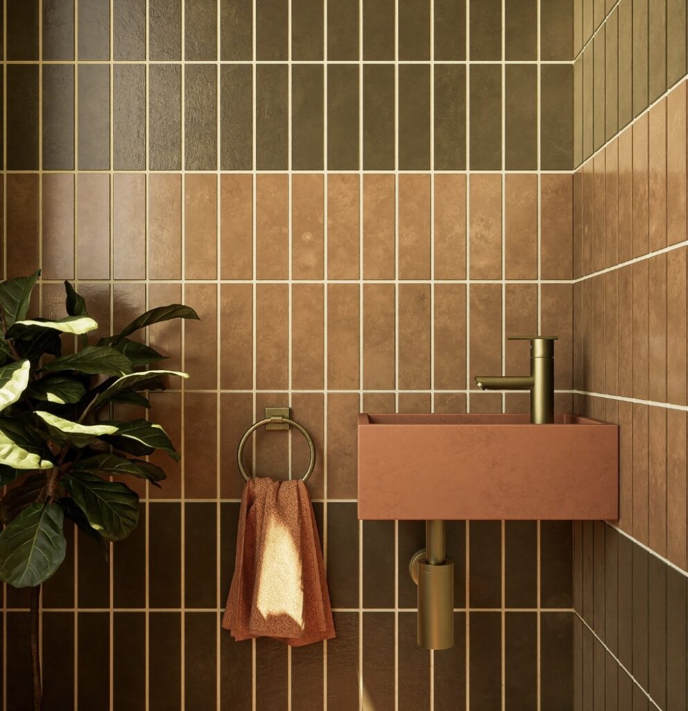 Autumn bathroom décor with Smith & Goat terracotta concrete cloakroom basin, brass tap and vertical tiles.