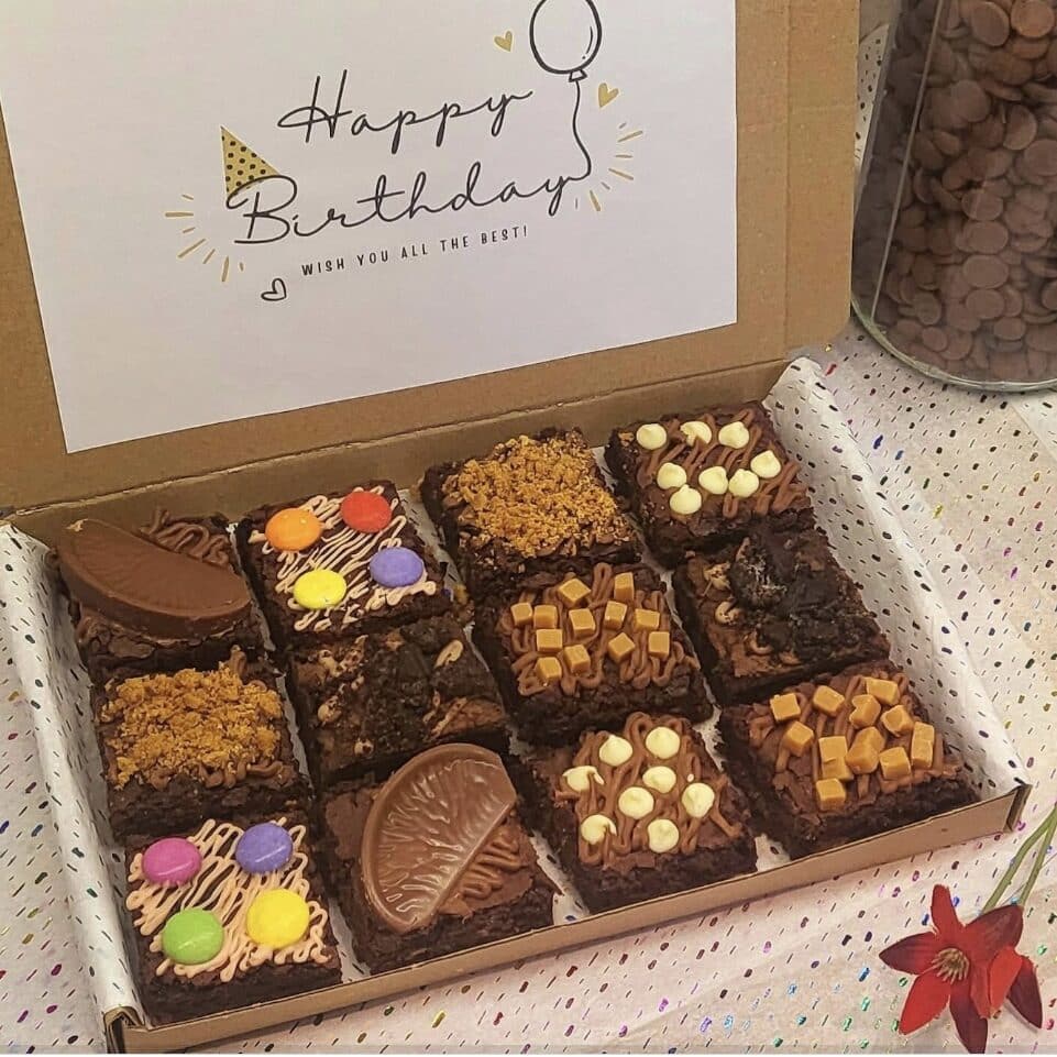 Chocolate brownie decoration with nuts, caramel fudge, chocolate sprinkles and more