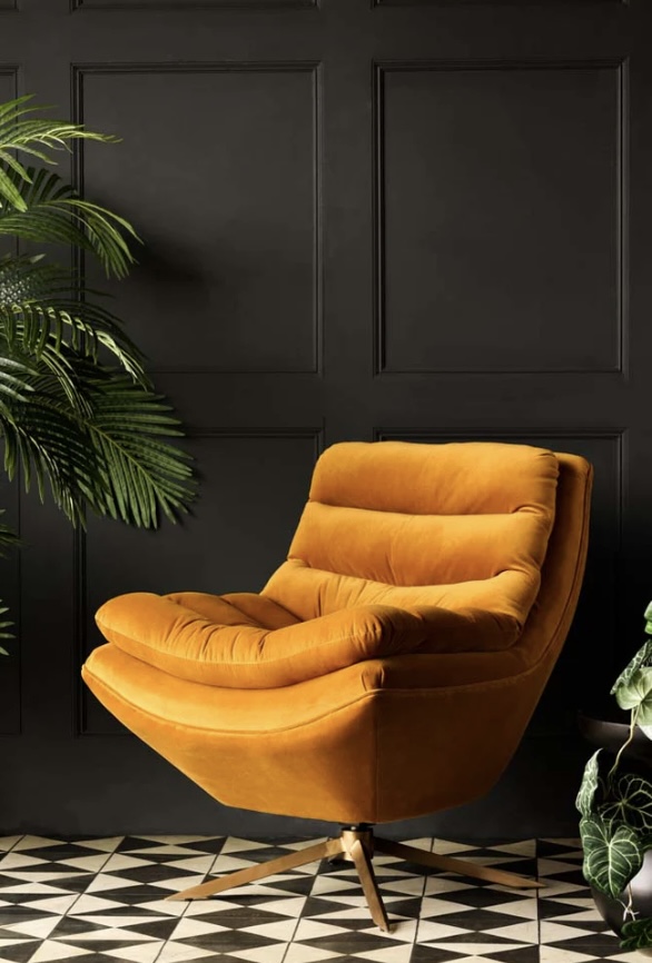 Retro mustard swivel chair in modern retro interior design