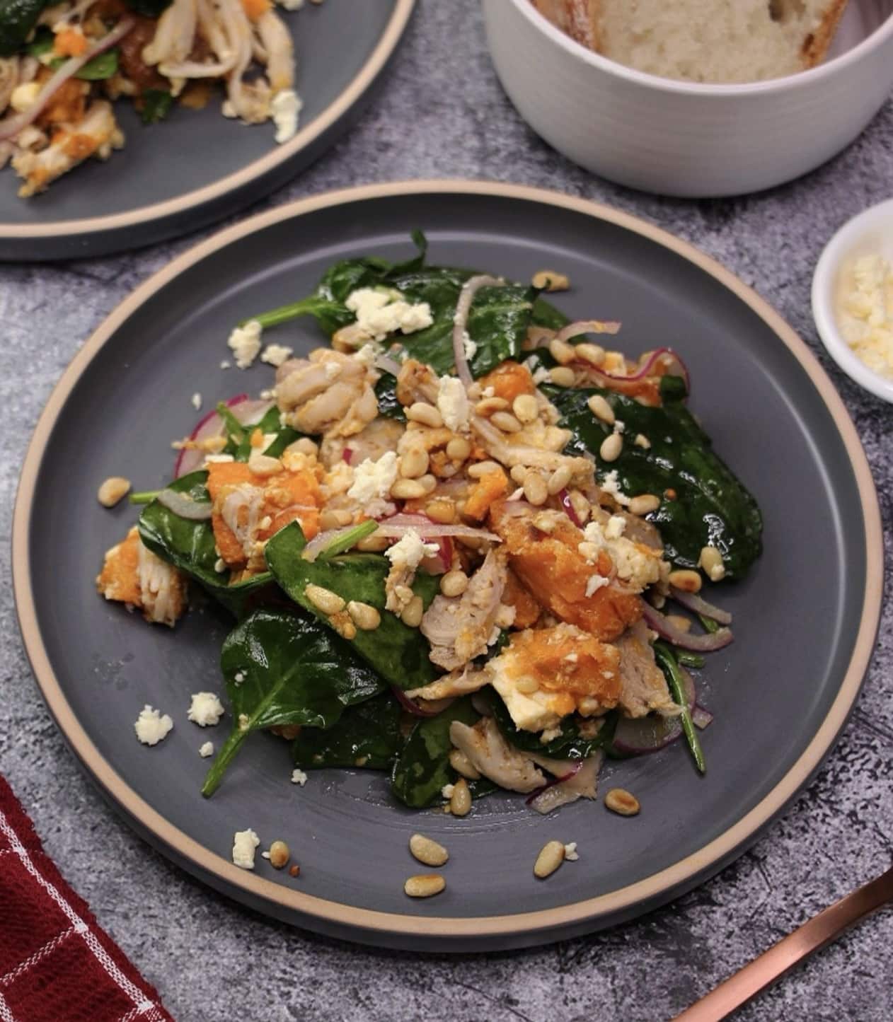 Warm chicken salad with fresh greens and light dressing – a simple spring lunch or light dinner.