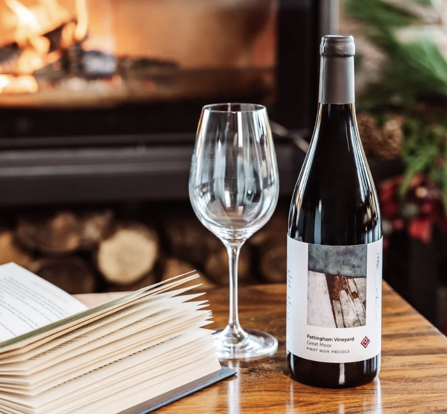 Glasses of English Pinot Noir on a beautifully set dining table