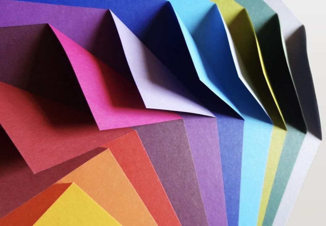 Colourful folded square origami paper pack for Christmas crafts