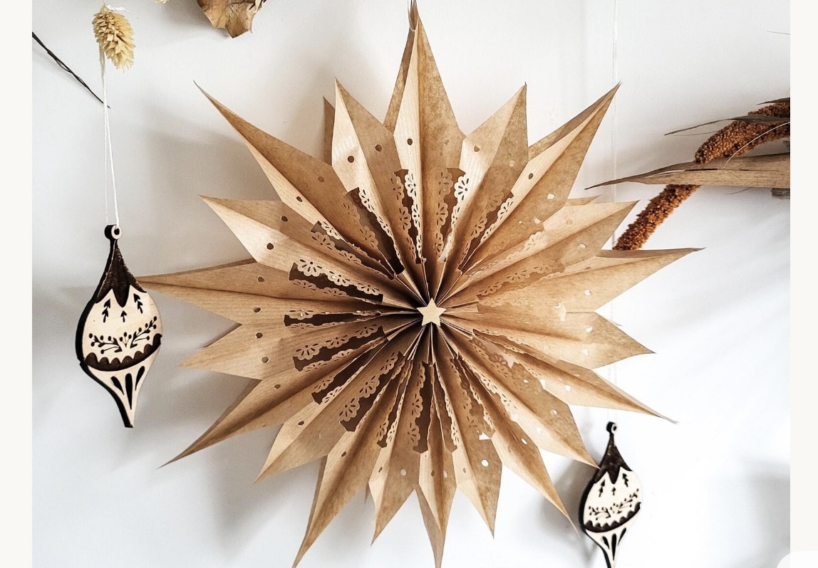 Large boho paper star decoration in warm neutral tones