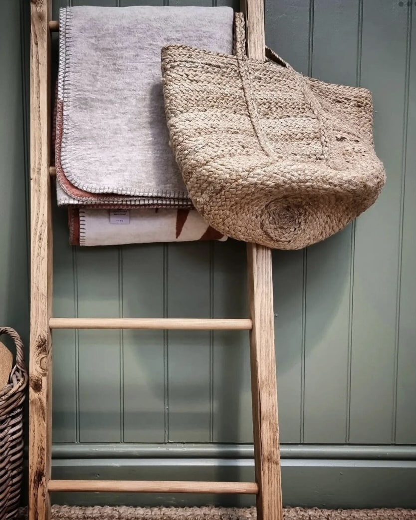 Wooden blanket ladder with chunky knit throw