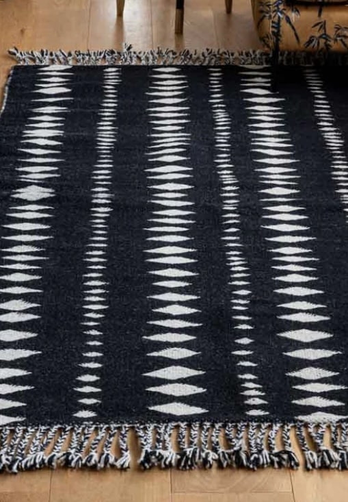 Black and off-white geometric flatweave rug