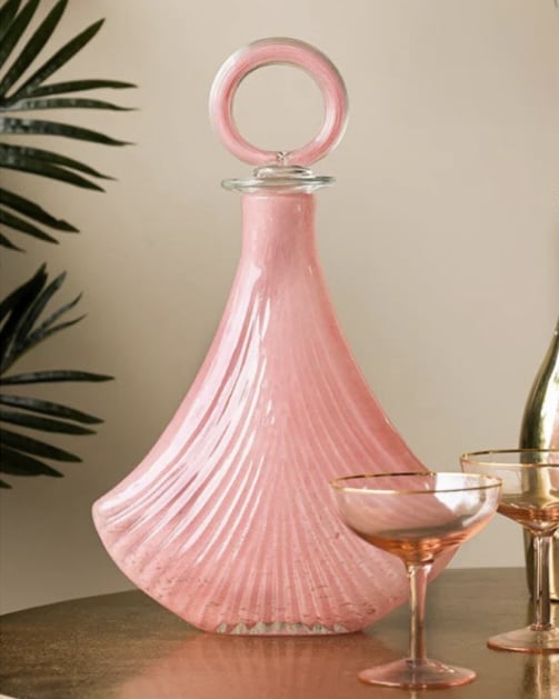 Pink glass Art Deco decanter styled with cocktail glasses