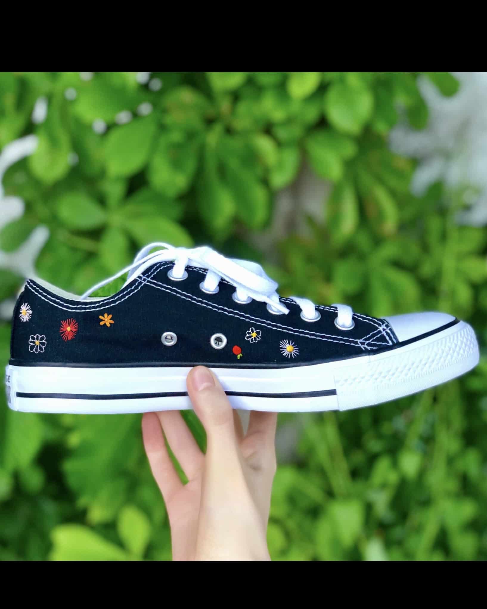 Custom black Converse trainers embroidered with colourful flowers