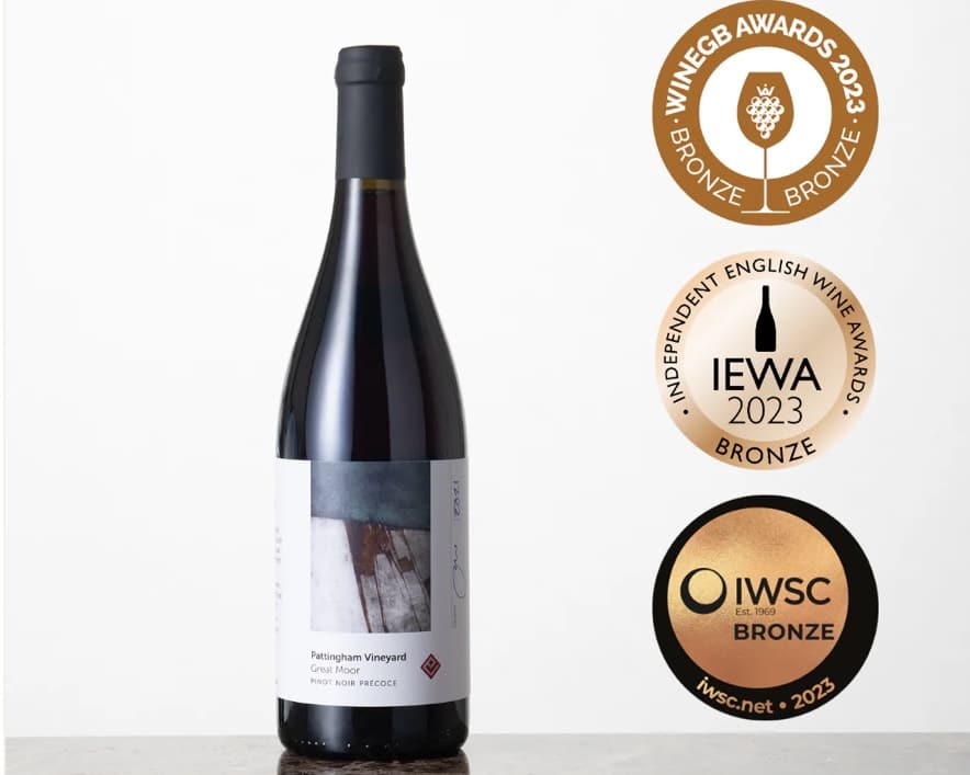 Bottle of English Pinot Noir on a simple background