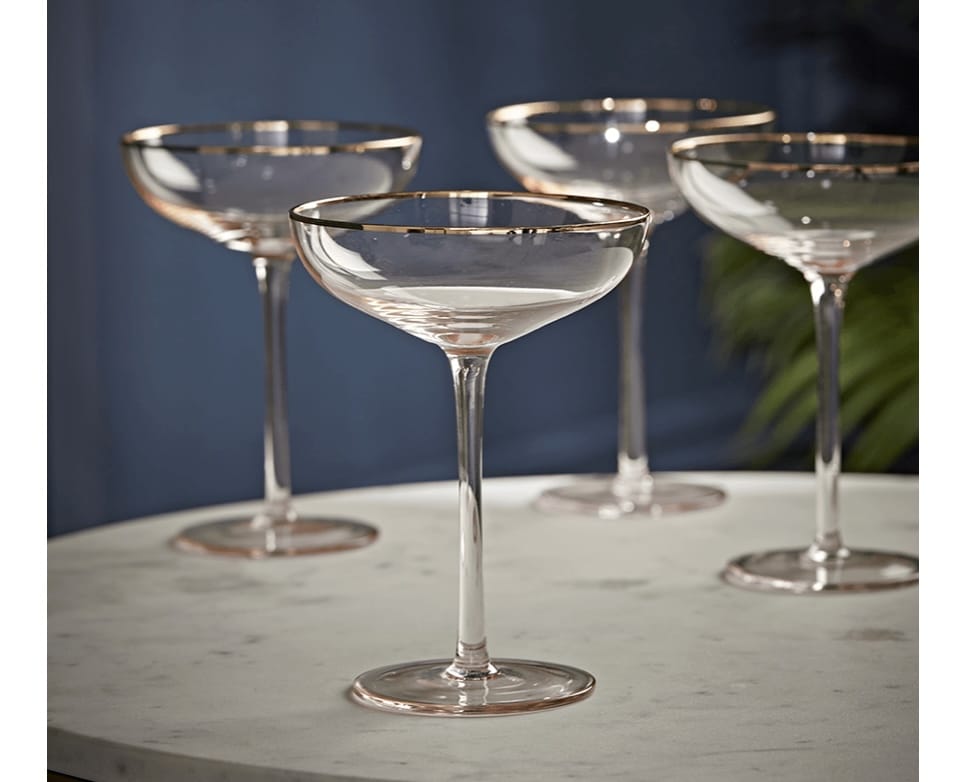 Set of four gold and blush champagne coupes