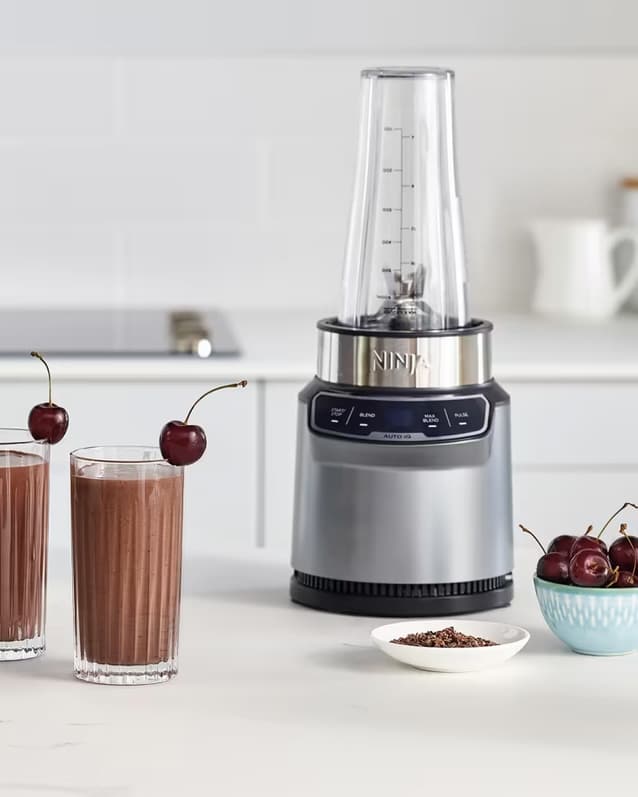 Ninja Blender with Auto-iQ BN500UK on a kitchen counter with smoothies