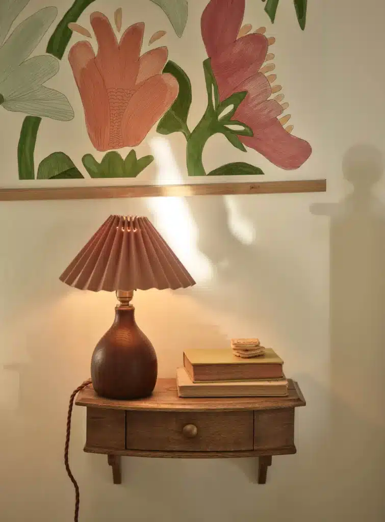 Rowen & Wren Archer Bedside Shelf in oiled oak — wall-mounted bedside shelf with drawer, styled with pleated lamp and botanical wall art