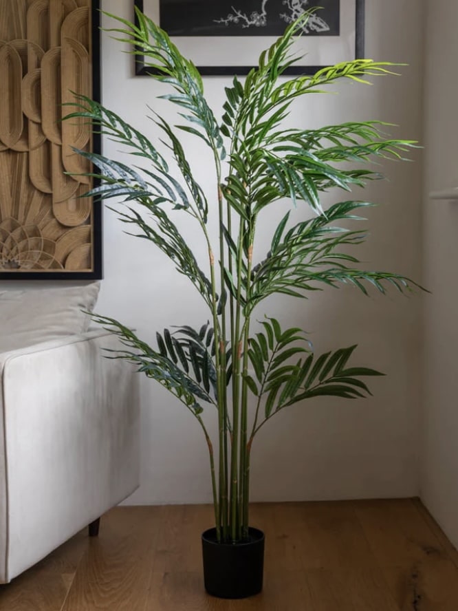 Extra large faux bamboo tree in a living space