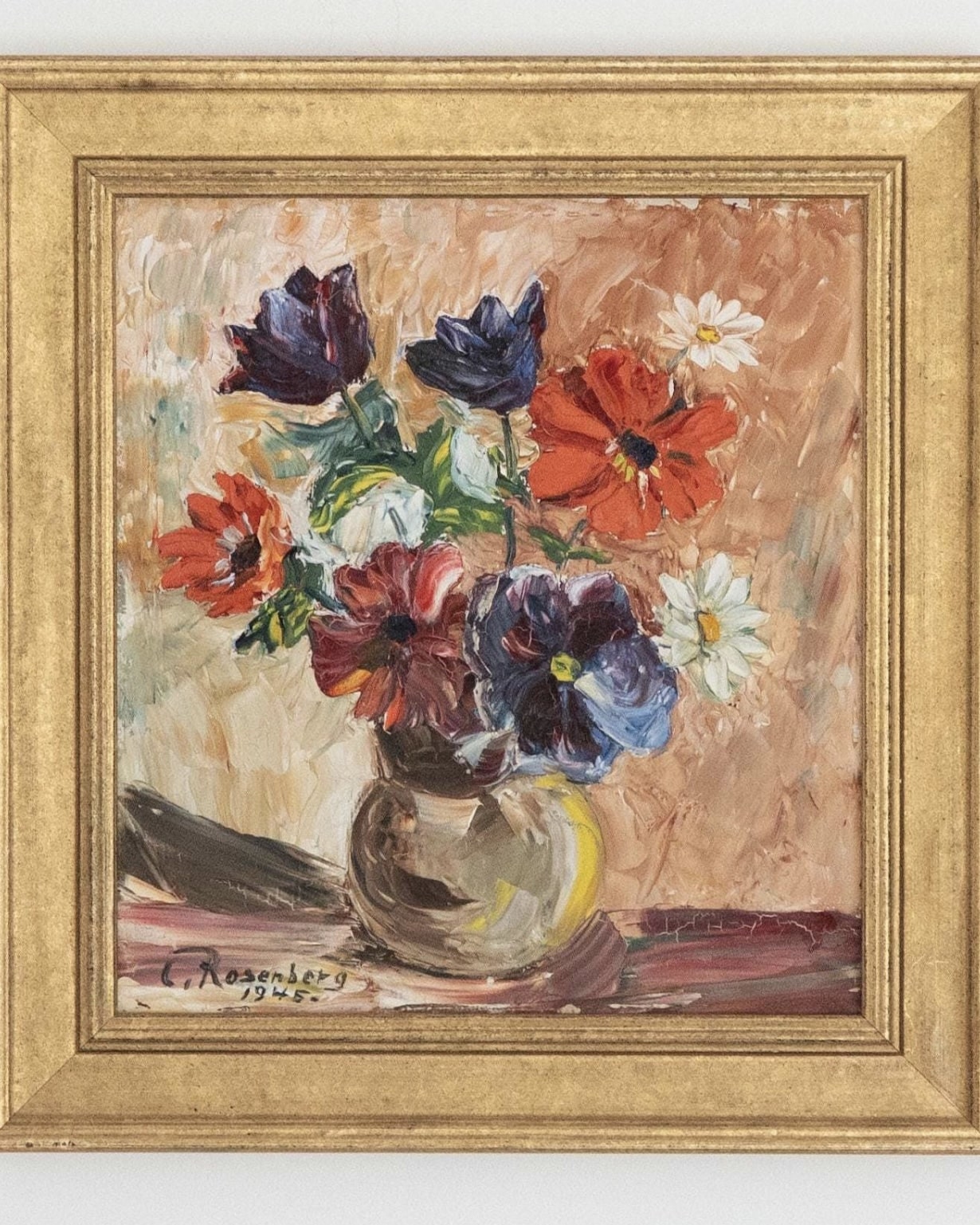 Vintage floral artwork to soften a blue bedroom