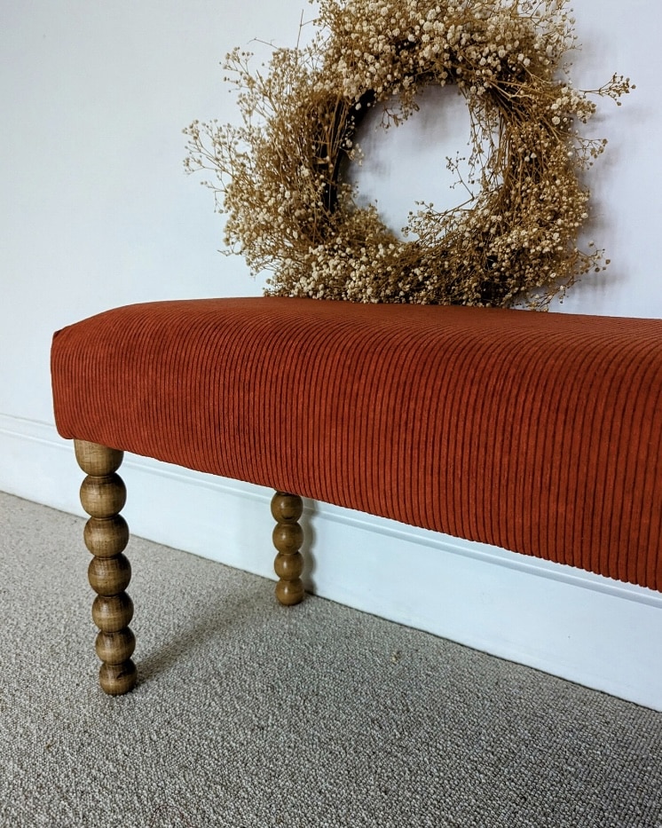 Burnt orange bobbin bench for the end of the bed