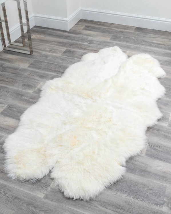 Natural sheepskin rug for beside the bed