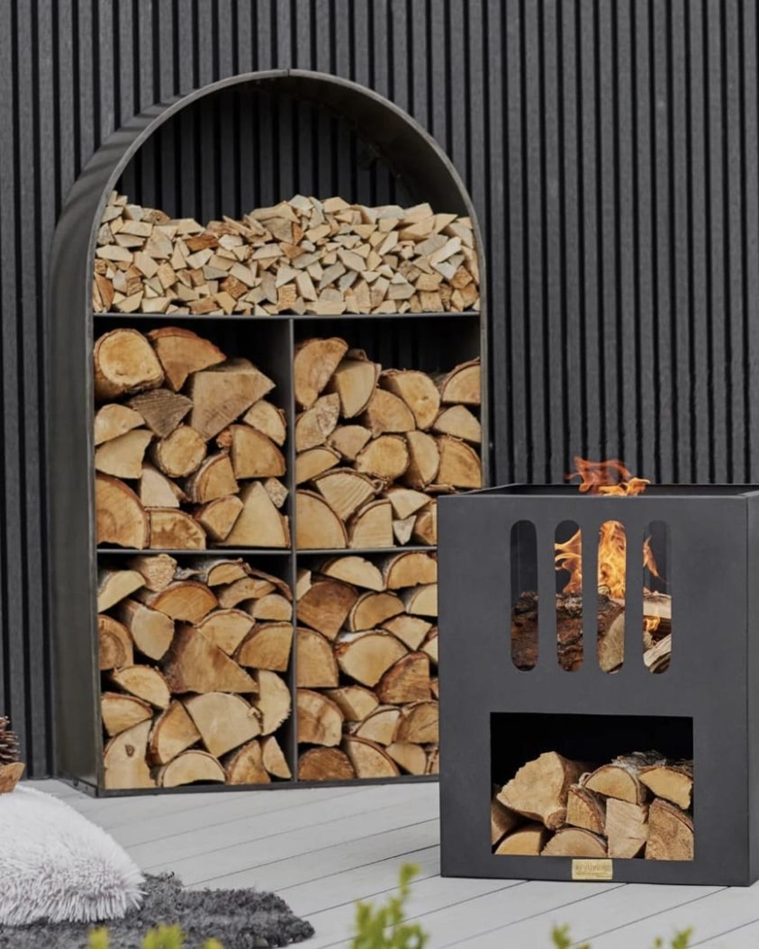 Archway sculptural log store for outdoor firewood storage