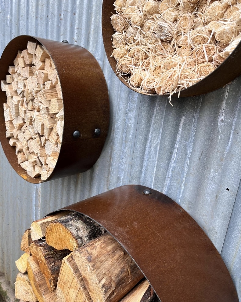 Corten steel firewood storage rings for wall-mounted outdoor firewood storage