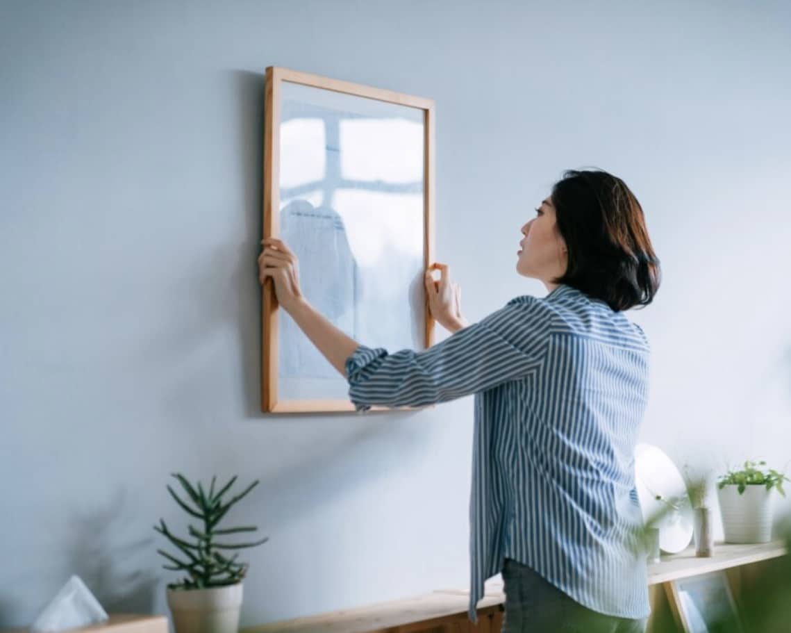 Hands hanging framed wall art