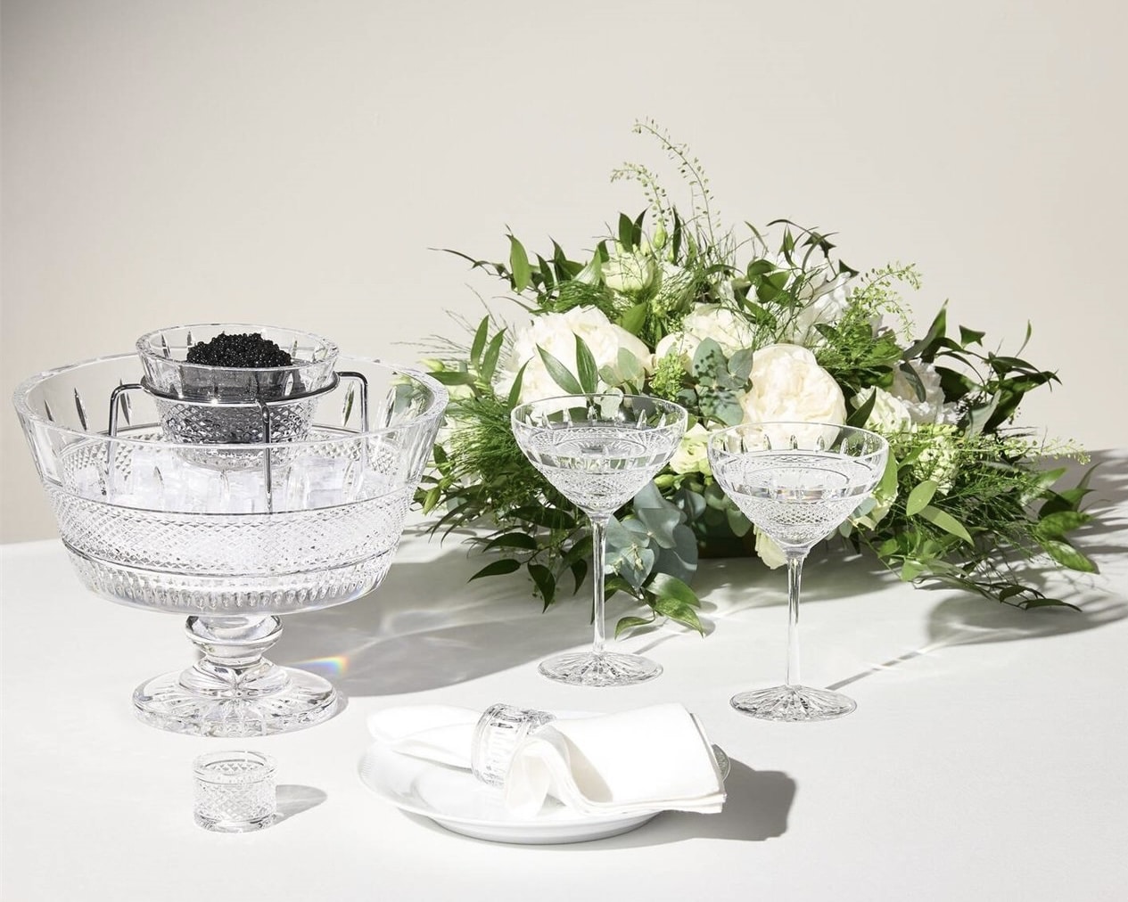 Waterford Mastercraft Irish Lace crystal caviar set styled with coupe glasses and flowers