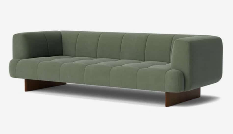 Green tufted sofa