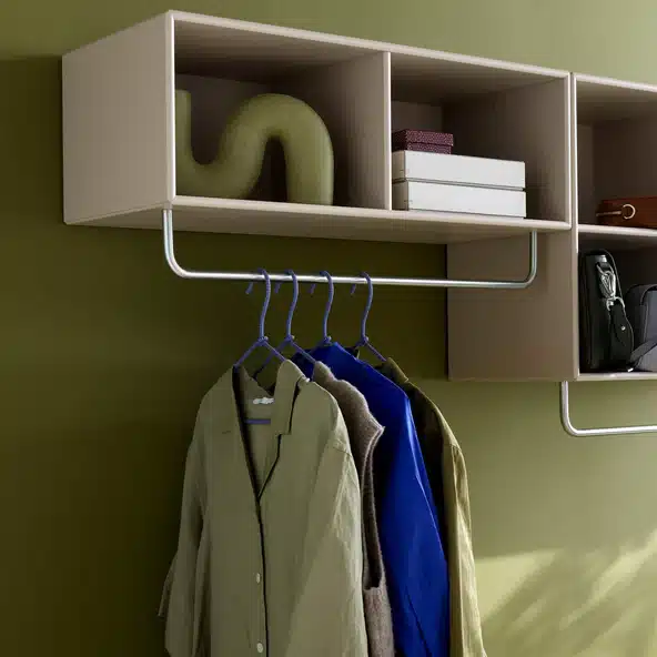Small Bedroom Storage Ideas: 17 Smart Ways to Gain Space Without Losing Style Small bedroom storage ideas Montana coat shelf Small bedroom storage idea: Montana Coat Shelf with Rack in Iris, a wall-mounted shelf and hanging rail for coats and bags by the bedroom door.